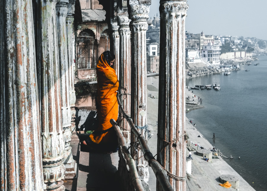 Girl-orange-robe-river-ganges-varanasi-India