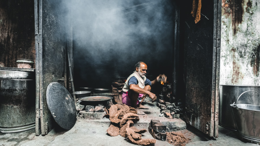 Man-cow-dung-fire-Varanasi-India-Nathan-Brayshaw