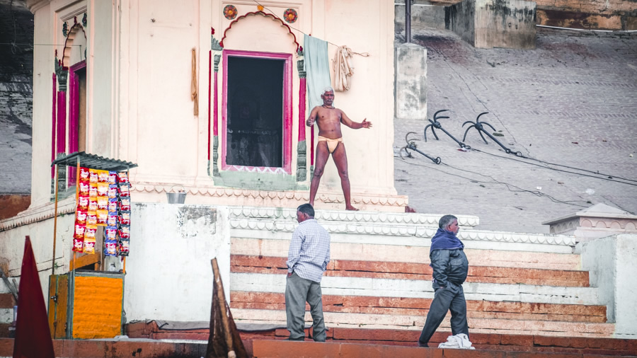 Man-Yoga-cow-varanasi-India-Nathan-brayshaw