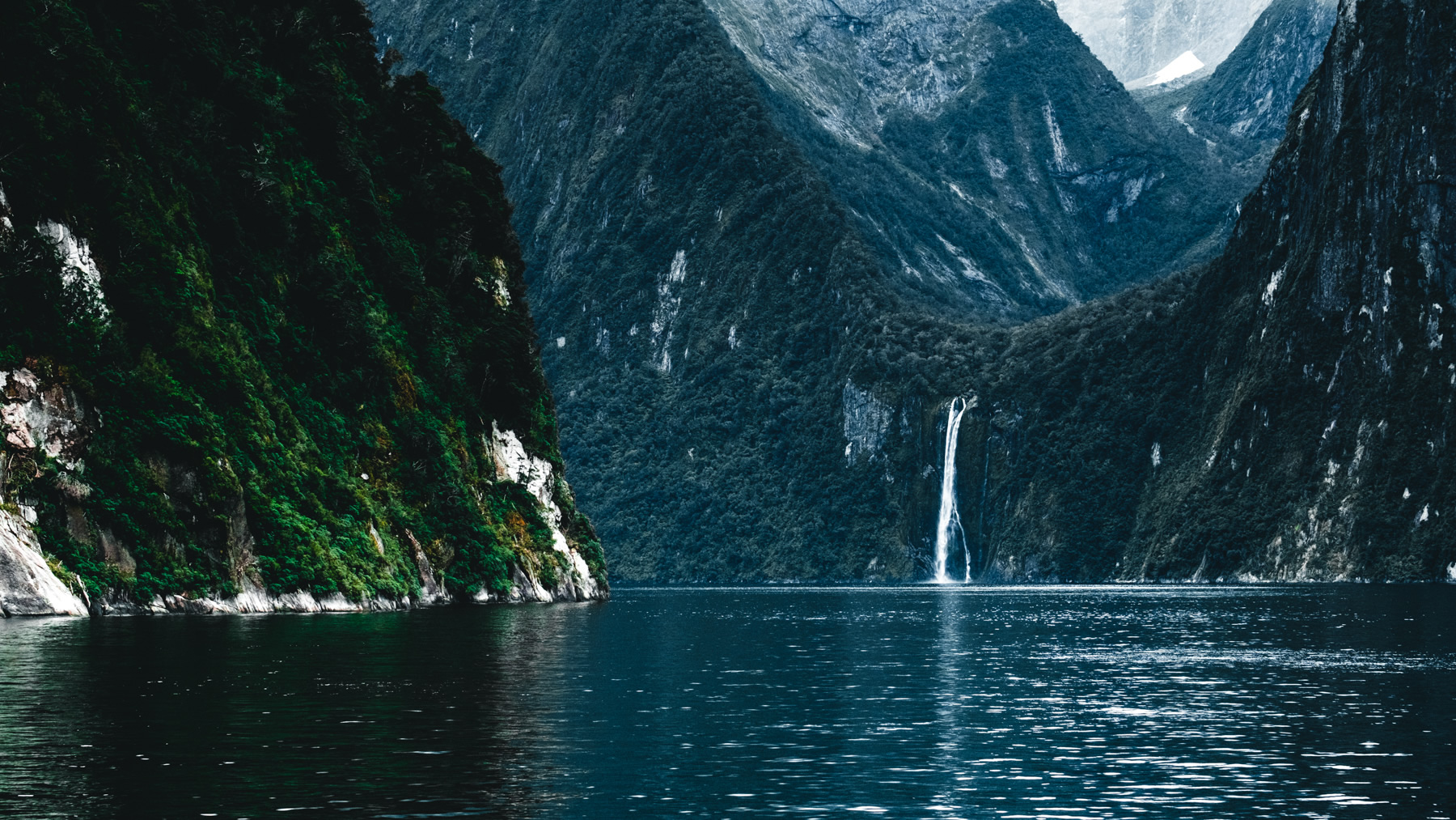 Waterfall, mountains, milford Sound, New Zealand,